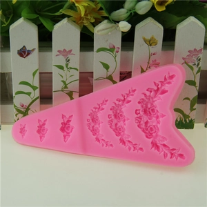 Pink silicone fondant mold with six rose flower designs for cake border decorating