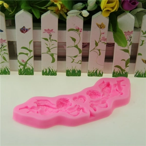 Detailed macro view of pink silicone mold with angel and cupid patterns for cake decorating