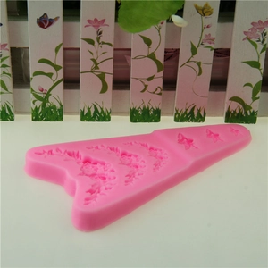 Pink silicone fondant mold with 6 floral and butterfly patterns for cake decoration