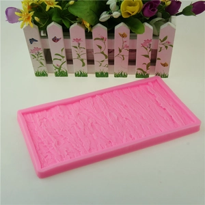 Pink rectangular silicone mold with tree bark texture for DIY cake decorating