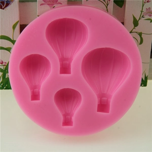 Pink silicone mold featuring four hot air balloon designs for cake decorating and DIY baking