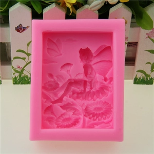 Pink silicone fairy soap mold with detailed floral relief pattern for candle making