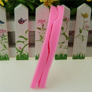 Detail view of pink silicone lily flower petal mold showing the flexible side seam structure
