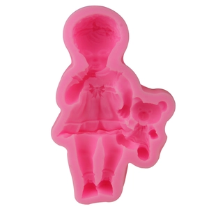 Detailed pink silicone mold featuring a standing girl holding a teddy bear for fondant
