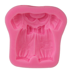 Detail of pink baby clothes silicone mold with bow and rocking horse patterns
