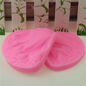 Detailed texture of pink silicone peony petal molds for fondant and cake decorating