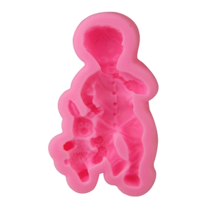 Detailed pink silicone fondant mold featuring a little boy hugging a rabbit 3D relief design