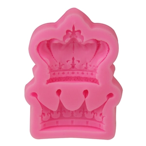 Detail view of pink silicone mold featuring two different sizes of crown patterns for DIY baking