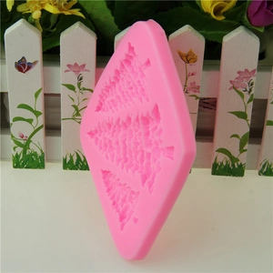 Pink silicone fondant mold with detailed Christmas pine tree patterns for cake decorating