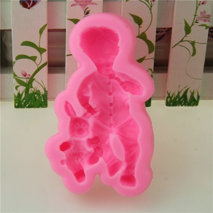 Pink silicone mold featuring a boy holding a rabbit for fondant and chocolate DIY baking