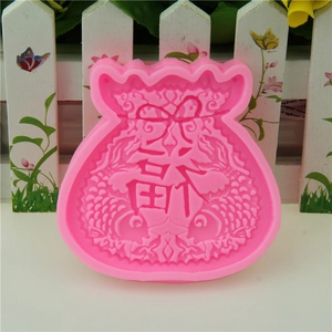 Pink silicone fondant mold featuring traditional Chinese lucky bag design with koi fish