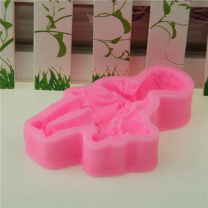 Pink silicone mold featuring baby girl design for fondant cake and DIY baking tools