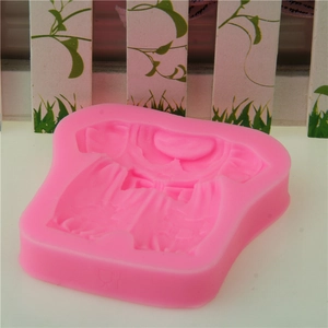 Pink silicone baby dress mold for fondant and cake decorating showing intricate details