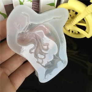 Translucent silicone mold featuring a detailed mermaid design for UV resin and DIY crafts