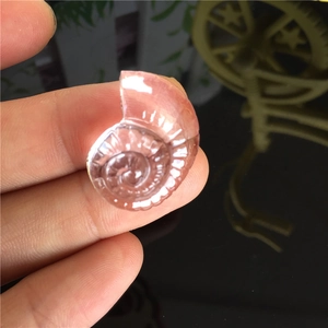 Pink silicone mold for seashell and nautilus shapes, perfect for DIY resin craft projects