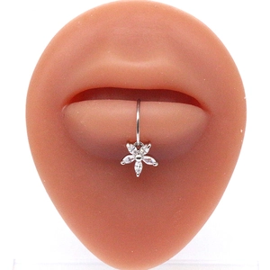 Macro detail of silver petal lip ring with sparkling cubic zirconia on a model