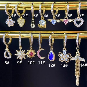 Gold celestial earrings set featuring stars, moons and hearts with zircon inlay