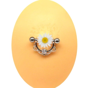 Daisy zircon nipple shield ring with surgical steel barbell on silicone model