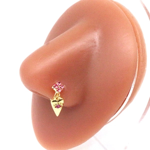 Close-up of gold nose stud with pink zircon cluster and heart evil eye pendant