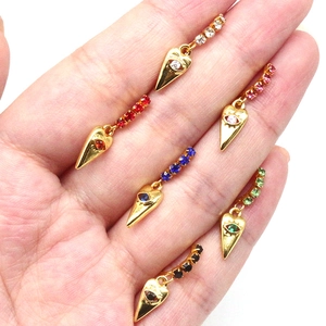 Set of six gold-tone heart evil eye nose rings with colorful rhinestones in hand