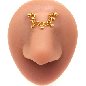 Golden stainless steel bridge piercing with chain and five small bead pendants