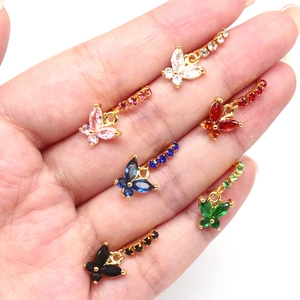 Detail of butterfly navel rings with colorful marquise stones and gold plating