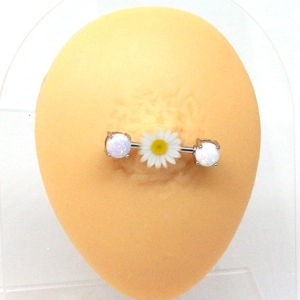 Detail showing daisy charm and opal stones on a stainless steel nipple ring bar