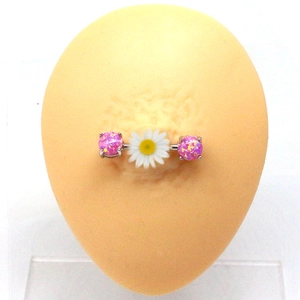 Detailed macro view of daisy opal nipple ring with pink beads on surgical steel bar