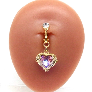 Detailed view of heart-shaped belly ring with purple crystal and gold finish