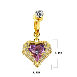 Close-up of heart-shaped belly ring with purple gemstone and white crystal inlay