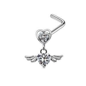 Macro detail of silver L-shaped nose stud featuring angel wing and heart zircon setting