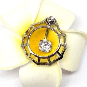 Macro shot of silver dolphin belly button ring with sparkling zircon in a floral setting