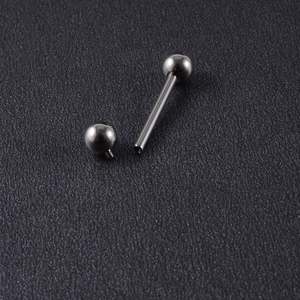 Detailed macro view of the internal thread connection on a polished G23 titanium labret bar