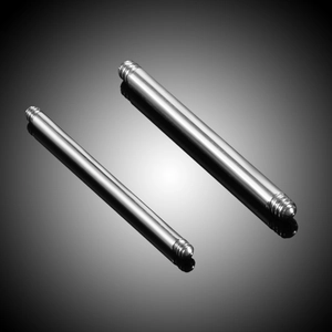 Close-up of G23 titanium labret posts with threaded ends for body piercing jewelry