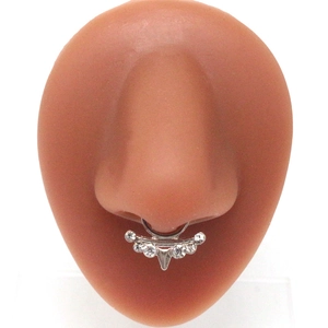 Silver septum nose ring with sparkling rhinestones on a silicone model detail view