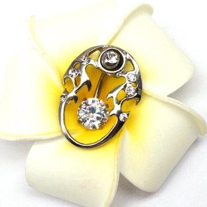 Detailed view of silver stainless steel dolphin navel ring with round clear zircon
