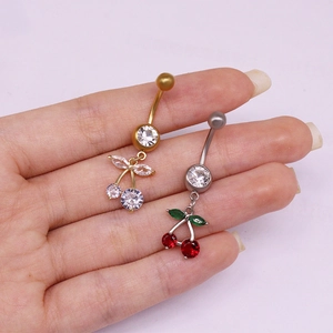 Piercings de ombligo con forma de fruta y circonitas en acabados oro y plata