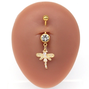 Close-up of golden dragonfly belly ring with sparkling zircon inlays on skin-tone model
