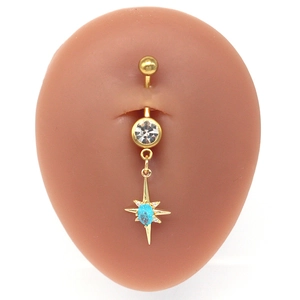 Gold star belly ring with blue oval stone and clear zircons on pink skin model