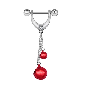 Detail of silver nipple shield with white zircon and hanging red bell pendants