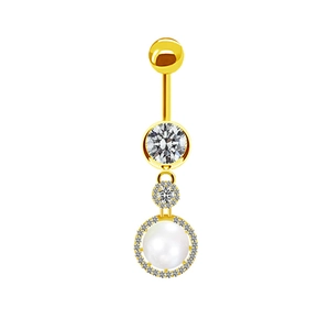 Detail of golden navel ring featuring a large clear gem and a pavé-set pearl drop charm
