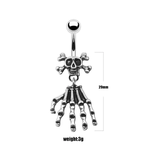 Macro detail of gothic skull belly button ring showing 29mm length and skeletal claw charm