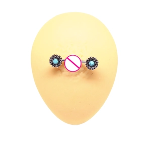 Detailed view of sunflower nipple rings with turquoise beads on silicone skin model