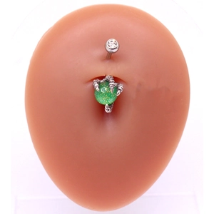 Detail of silver dragon claw navel ring with green sphere on silicone model