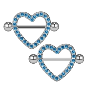 Close-up of heart-shaped nipple rings with light blue zircon stones in silver finish