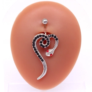 Detail of snake belly button ring with black rhinestones on a silicone navel model