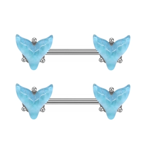 Detailed view of two pairs of silver nipple rings featuring light blue marble mermaid tails
