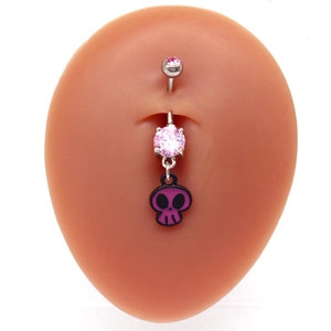 Detailed view of silver belly ring featuring a pink gem and purple skull pendant