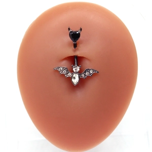 Gothic bat belly ring with black devil heart gem and rhinestones on skin model