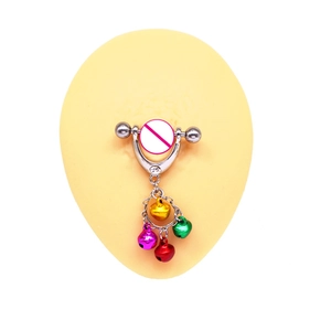 Detailed macro shot of barbell nipple rings featuring four colorful hanging bells